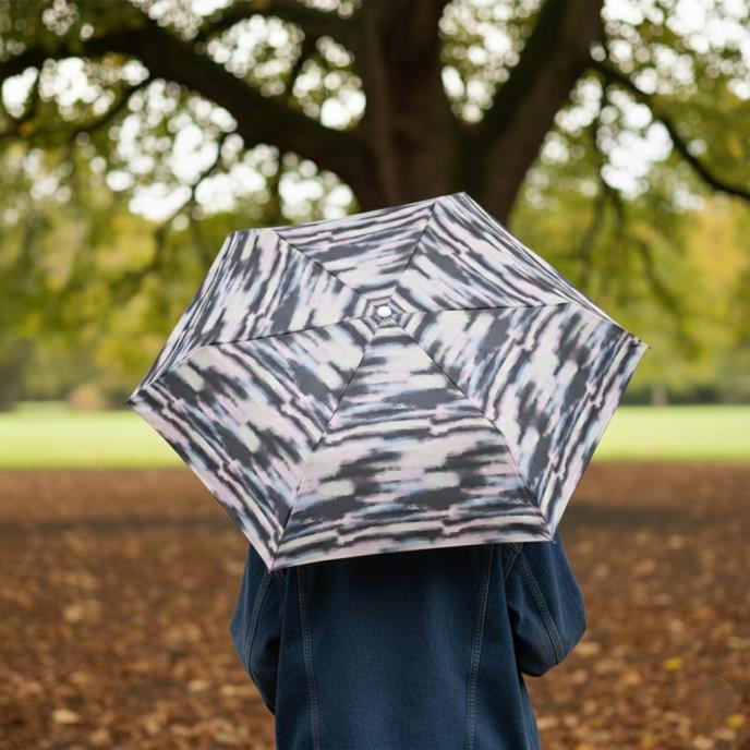 Totes ECO Tiny X-tra Strong Folding Umbrella - Mini Striped Clouds - lifestyle view - Umbrella World